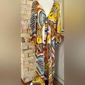 Unique design sheer wrap that ties at breast bone then full length sheer duster